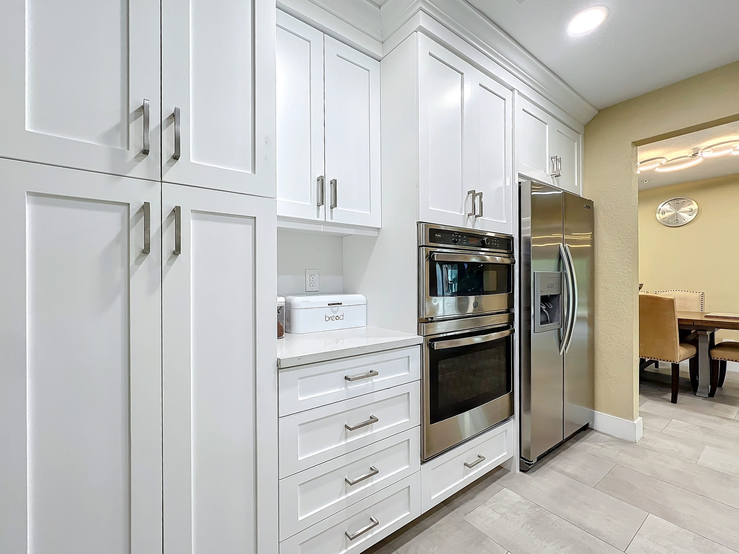 Close-up of the gourmet kitchen showing high-end appliances and workspace at Abundant Care Residence in Wellington, FL