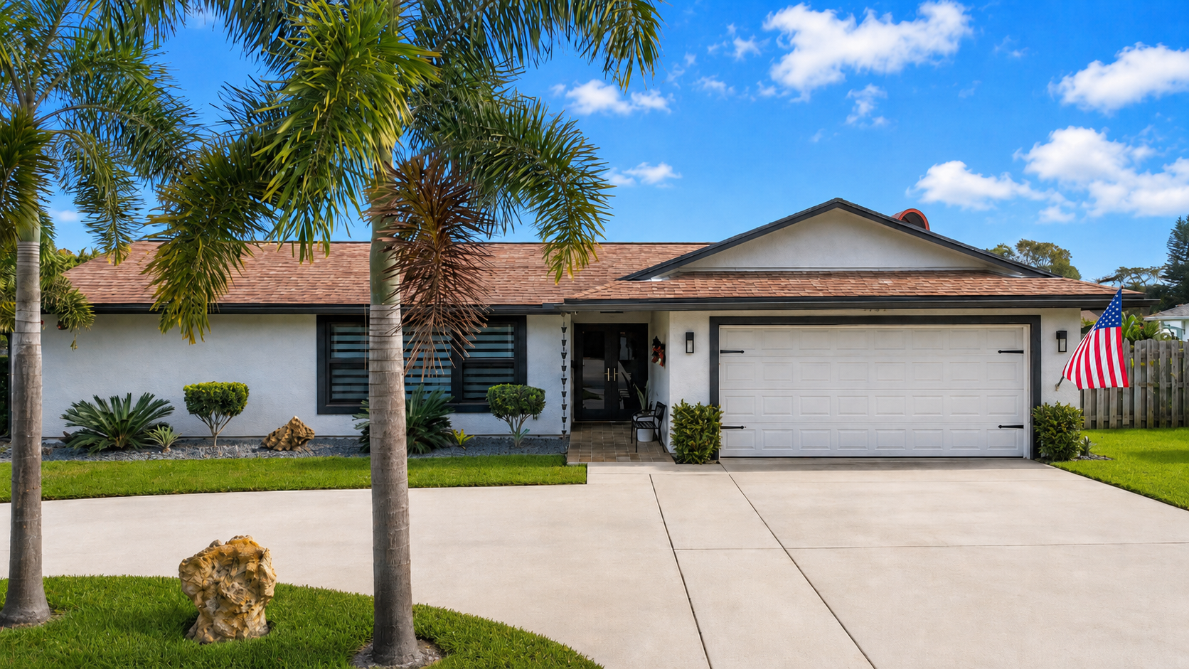 Scenic front exterior view of Abundant Care Residence's modern residential estate in Wellington, FL